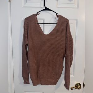 Pink sweater with knot on the back, size large